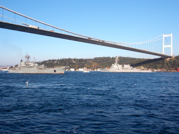 The Bosporus is a busy channel. Here USN Arleigh Burke Class Destroyer USS Ross heads west, whilst Novocherkassk heads east towards the Black Sea - Photo by Yörük Işık